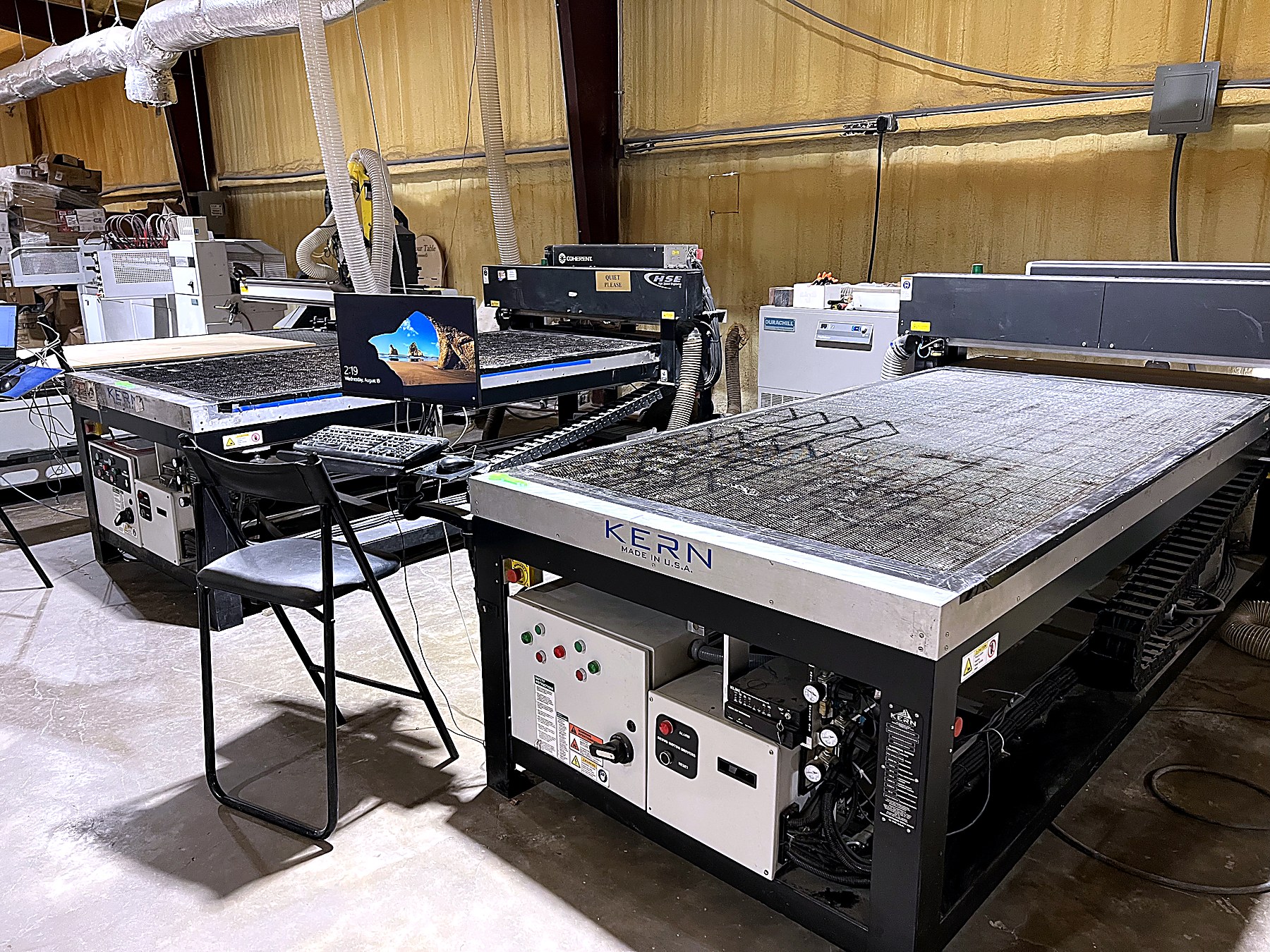 Both laser beds, so a rush job never waits on the other machine